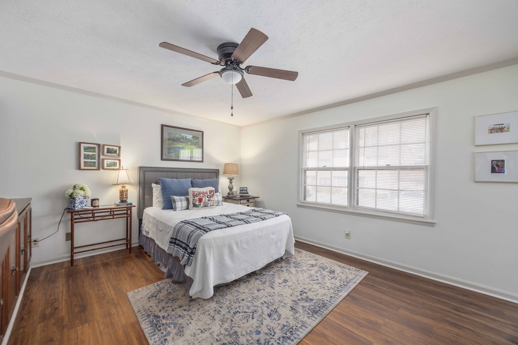2525 Norris Road, Unit 98 Columbus, GA 31907 - Photo 13 of 40 a bedroom with a large bed and a chandelier