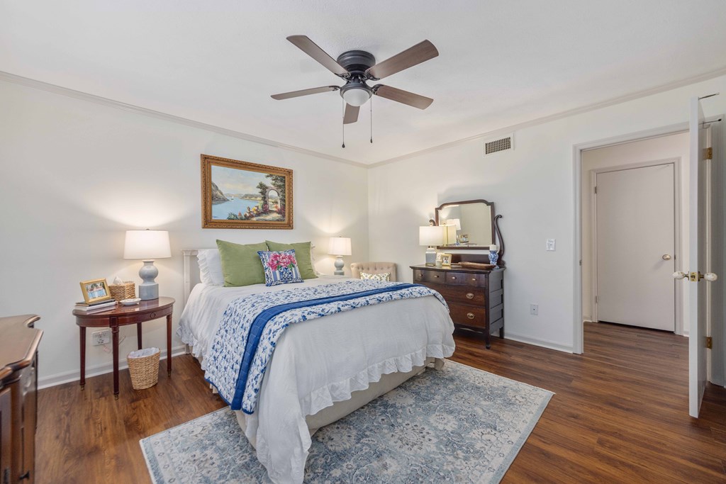 2525 Norris Road, Unit 98 Columbus, GA 31907 - Photo 14 of 40 a spacious bedroom with a bed and wooden floor