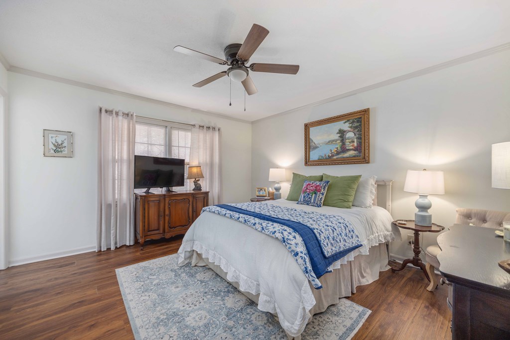 2525 Norris Road, Unit 98 Columbus, GA 31907 - Photo 15 of 40 a bedroom with a bed and a flat screen tv