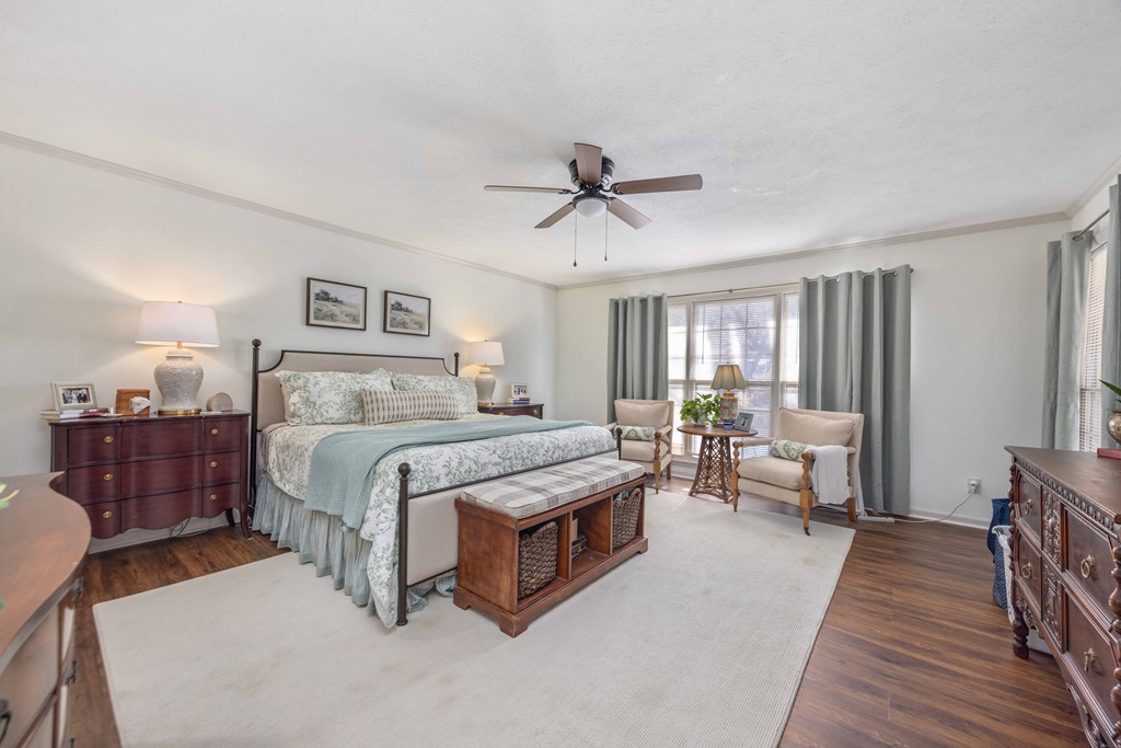 2525 Norris Road, Unit 98 Columbus, GA 31907 - Photo 16 of 40 a spacious bedroom with a bed a couch and a chandelier