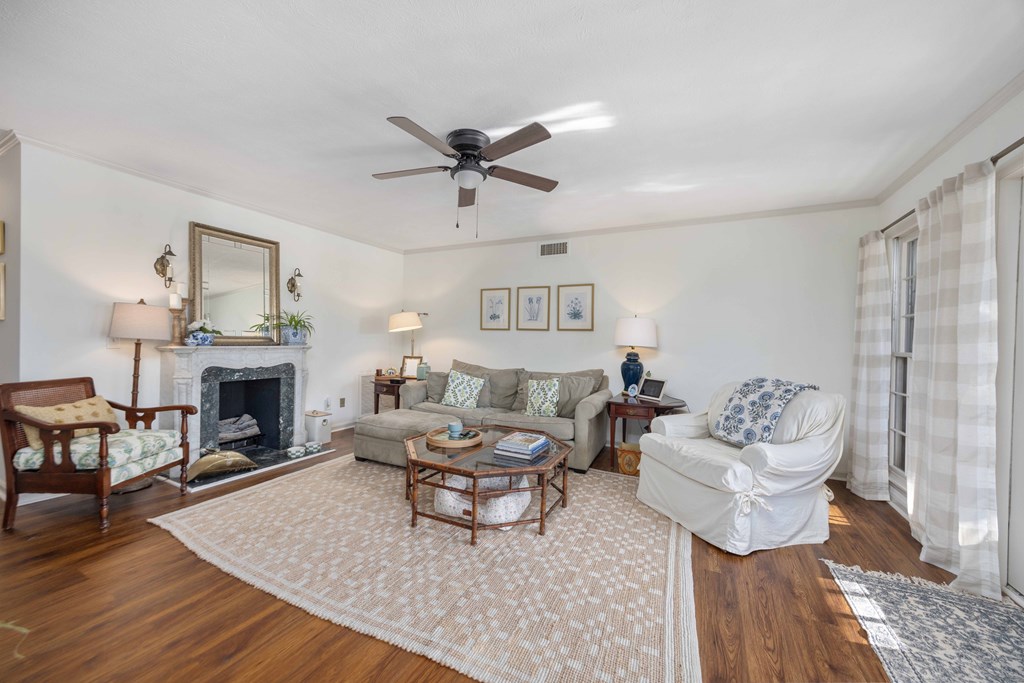 2525 Norris Road, Unit 98 Columbus, GA 31907 - Photo 2 of 40 a living room with furniture a fireplace and a table