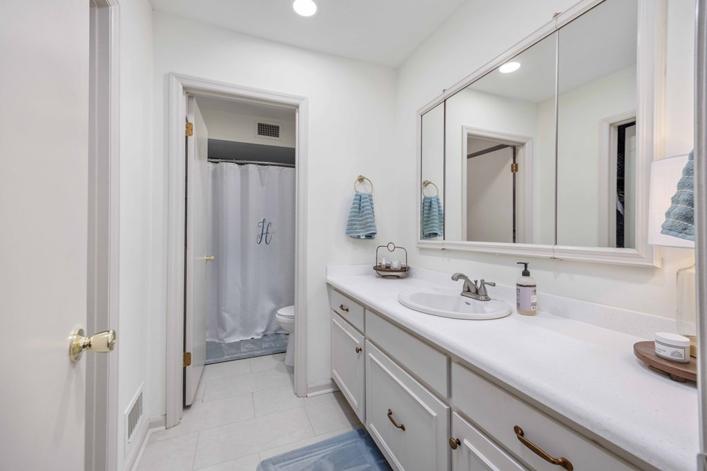 2525 Norris Road, Unit 98 Columbus, GA 31907 - Photo 21 of 40 a bathroom with a double vanity sink mirror and toilet