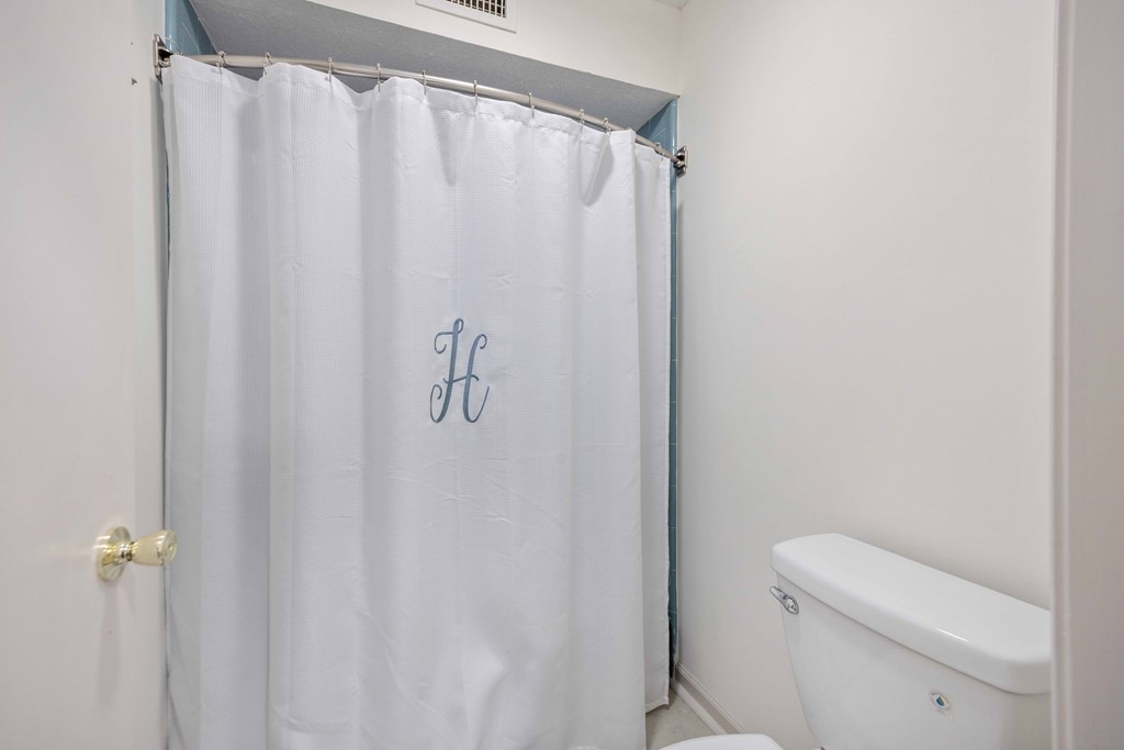 2525 Norris Road, Unit 98 Columbus, GA 31907 - Photo 22 of 40 a white toilet sitting next to a shower