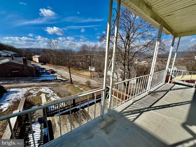a view of a balcony with an outdoor space