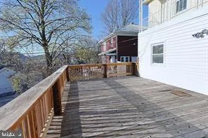a balcony view with two chairs and a table