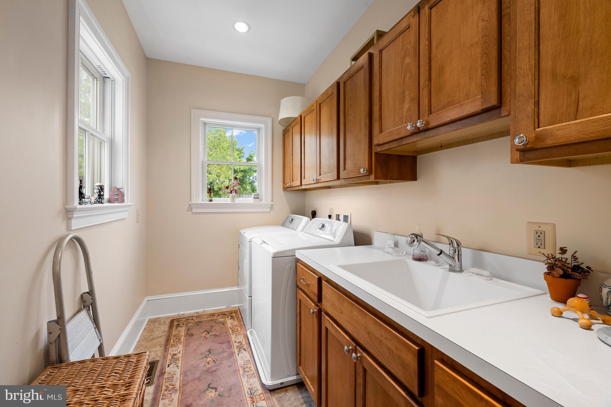 20147 Woodtrail Road Round Hill, VA 20141 - Photo 21 of 41 a view of a sink and dishwasher with wooden floor