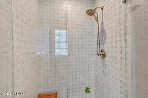 a kitchen with granite countertop a stove a sink a dining table and chairs