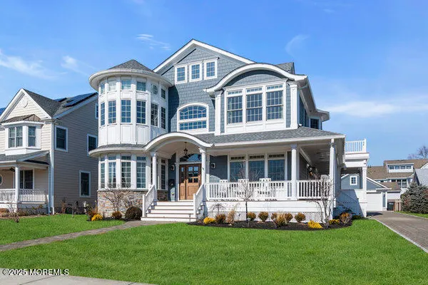 a view of a house with a yard and deck