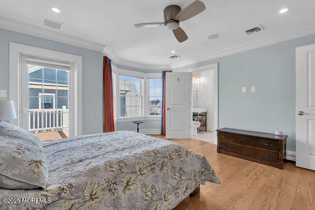 a view of a livingroom with a hall and wooden floor