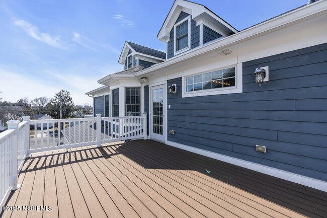 308 Pennsylvania Avenue Spring Lake, NJ 07762 - Photo 35 of 67 a view of a wooden deck with a yard