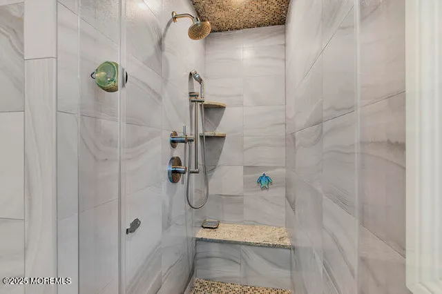 a view of a house with wooden fence and two windows