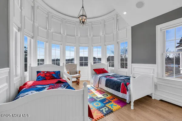 a view of balcony with wooden floor and fence
