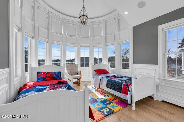 a view of balcony with wooden floor and fence