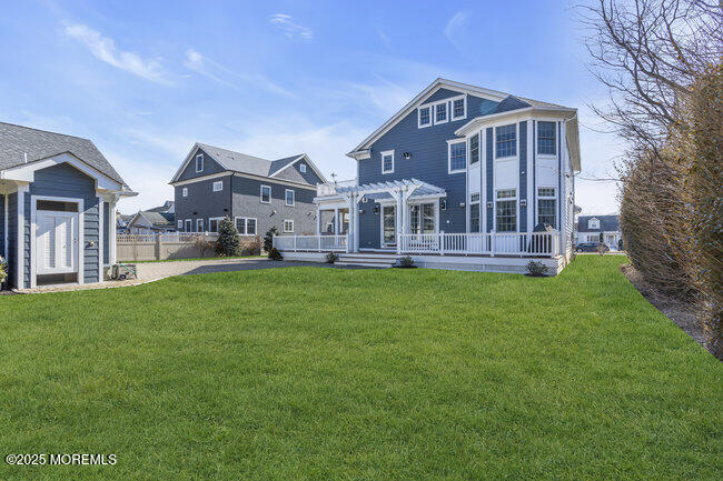 308 Pennsylvania Avenue Spring Lake, NJ 07762 - Photo 48 of 67 a front view of a house with a yard table and trees