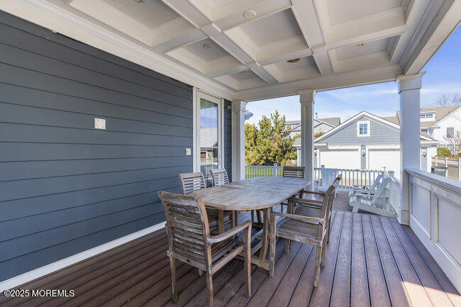 308 Pennsylvania Avenue Spring Lake, NJ 07762 - Photo 54 of 67 a view of a patio with table and chairs with wooden floor and fence