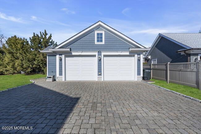 308 Pennsylvania Avenue Spring Lake, NJ 07762 - Photo 57 of 67 a front view of a house with a yard and garage