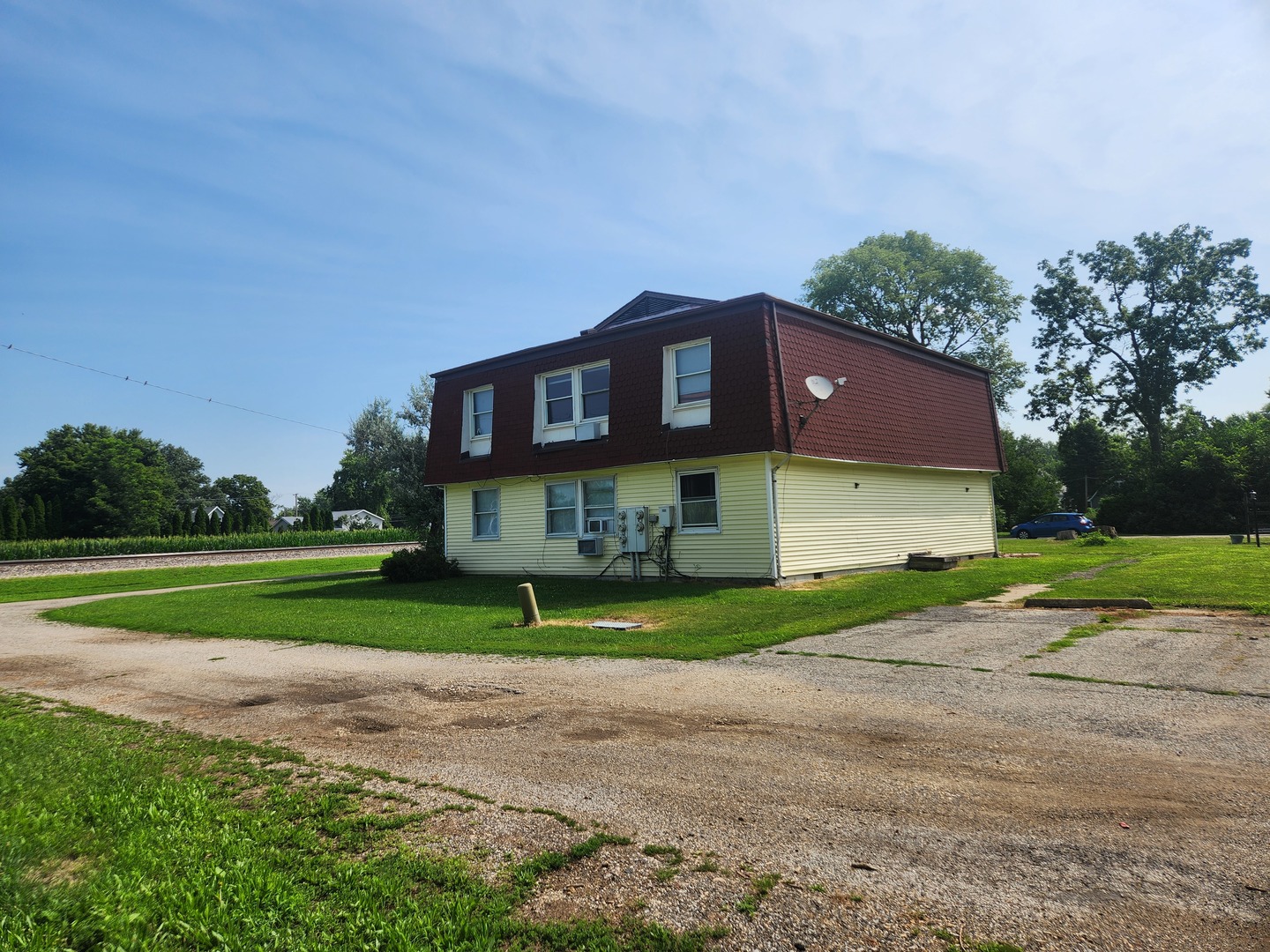 201-203 South Maple Street Toluca, IL 61369 - Photo 4 of 11 a view of a house with a yard