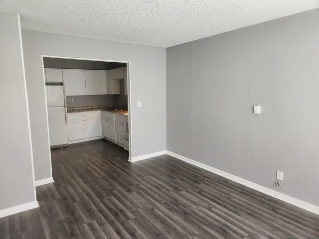 a room with wooden floors and closet