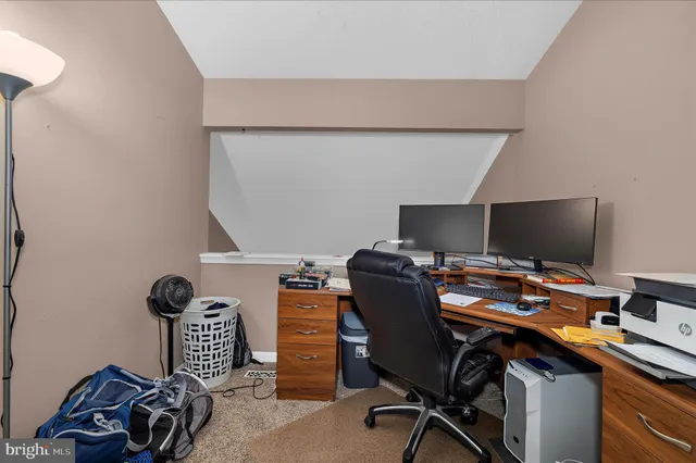 a view of a workspace with furniture