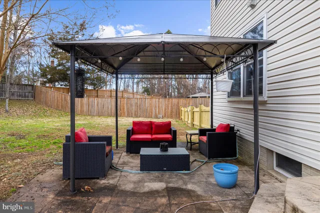 a view of yard with swimming pool and trees