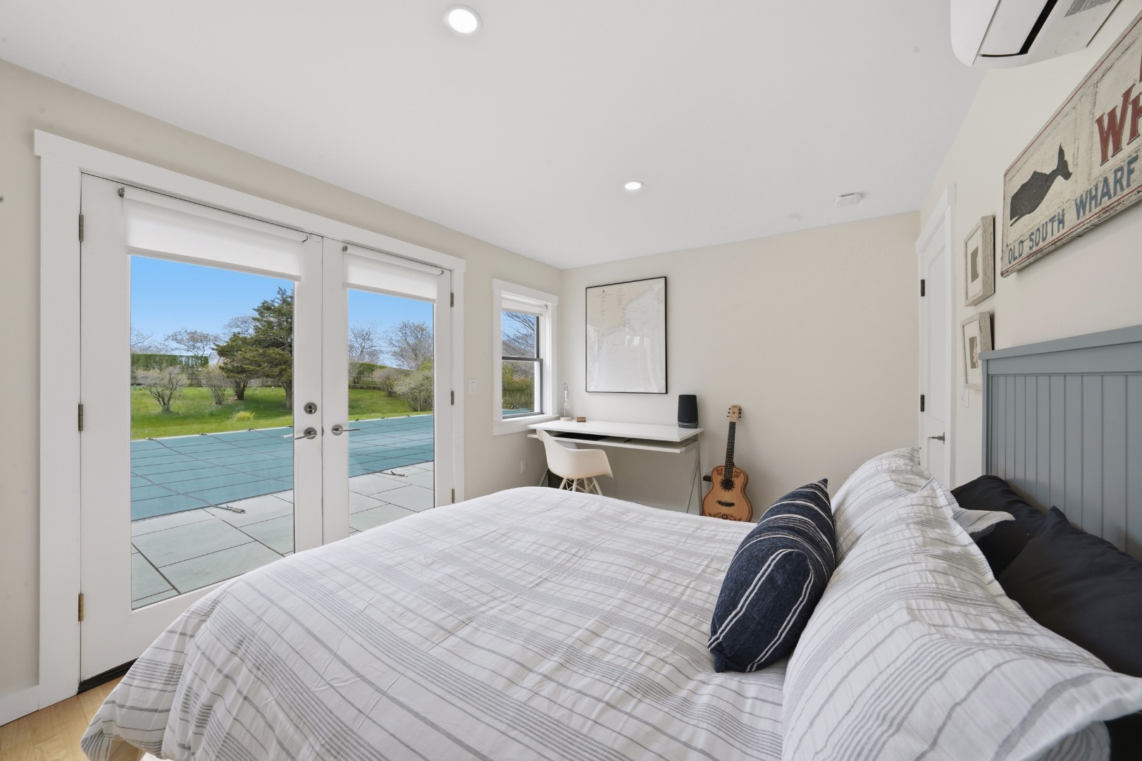 247 Polpis Road Nantucket, MA 02554 - Photo 29 of 52 a bedroom with a bed and large window