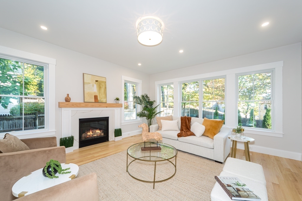 3 Ferndale Road Natick, MA 01760 - Photo 15 of 40 a living room with furniture and a fireplace