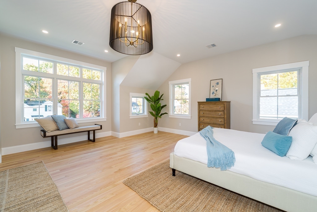 3 Ferndale Road Natick, MA 01760 - Photo 23 of 40 a spacious bedroom with a bed and wooden floor