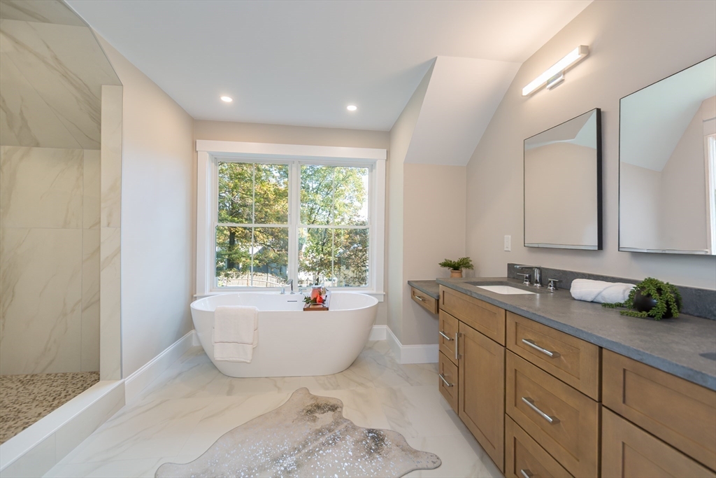 3 Ferndale Road Natick, MA 01760 - Photo 26 of 40 a bathroom with a tub sink and mirror