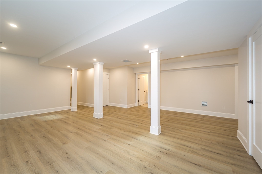 3 Ferndale Road Natick, MA 01760 - Photo 35 of 40 a view of an empty room with wooden floor