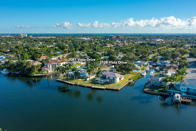 view of a lake with lawn chairs