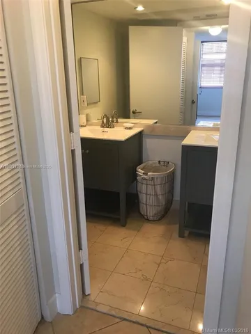 a bathroom with a bathtub and a window