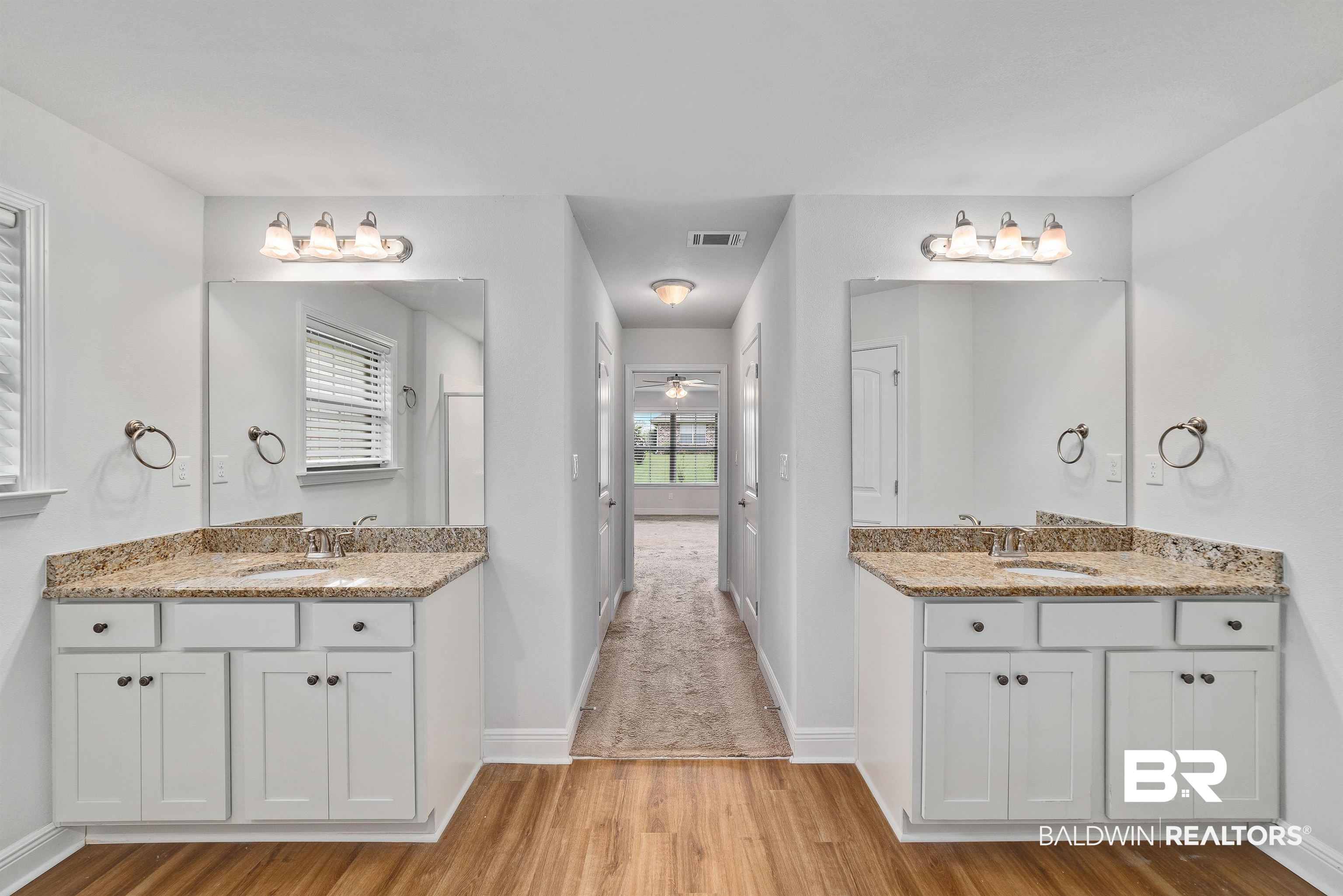 13155 Wishbone Court Foley, AL 36535 - Photo 21 of 39 Bathroom featuring wood-type flooring and double sink vanity