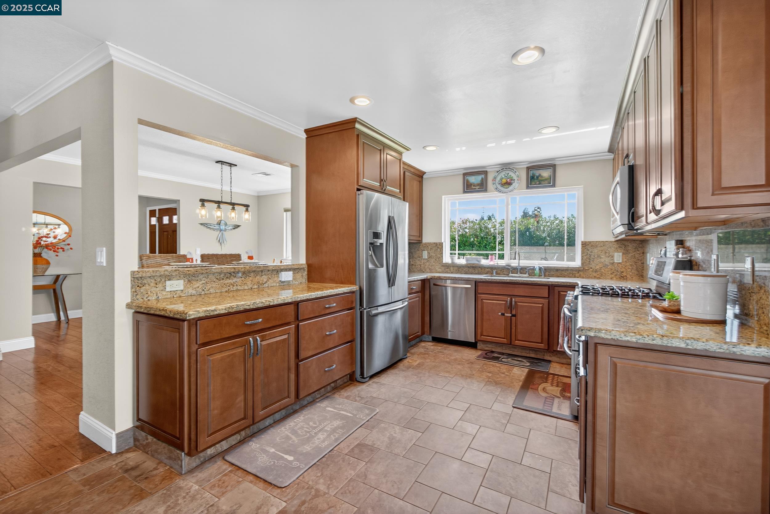 1827 Leo Lane Concord, CA 94521 - Photo 1 of 1 a kitchen with a sink refrigerator and cabinets