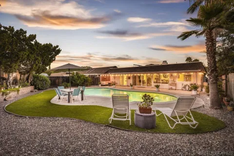 a view of a swimming pool with a patio