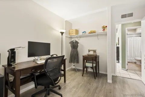 a workspace with furniture and wooden floor