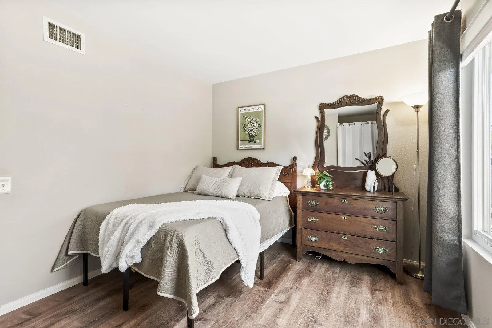 14152 Kendra Way Poway, CA 92064 - Photo 24 of 42 a bedroom with a bed and wooden floor