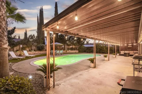 a view of a swimming pool with a patio