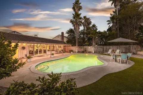 a swimming pool with outdoor seating yard and deck