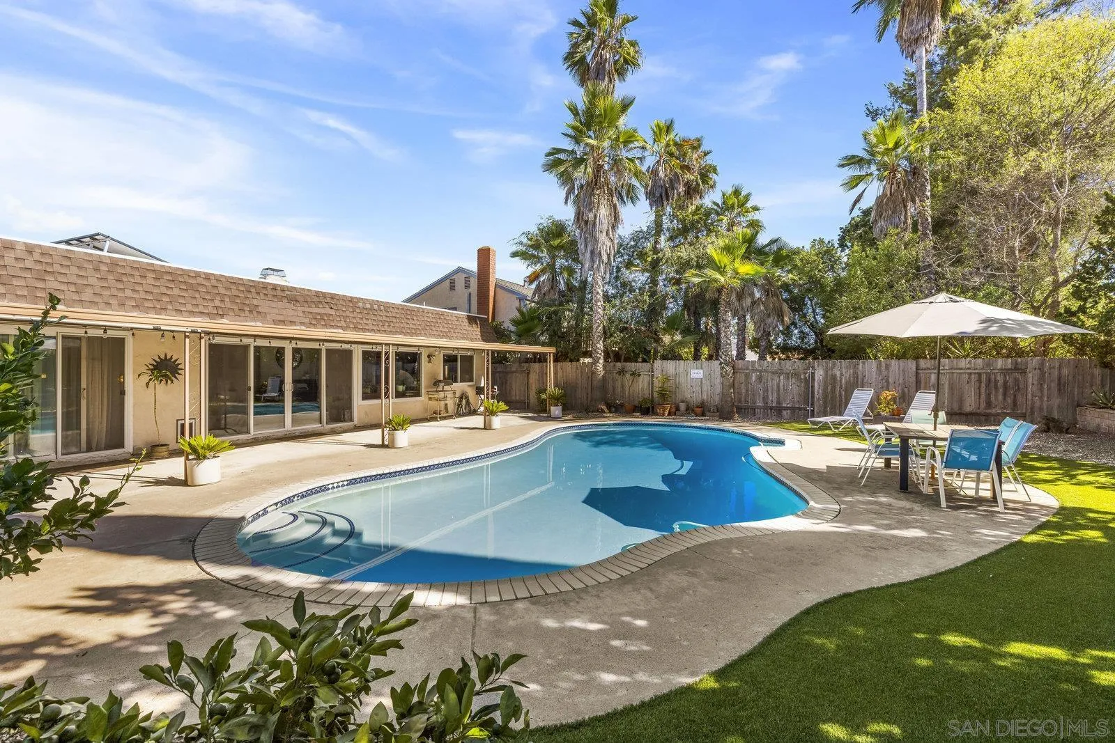 14152 Kendra Way Poway, CA 92064 - Photo 33 of 42 a view of a house with swimming pool and sitting area