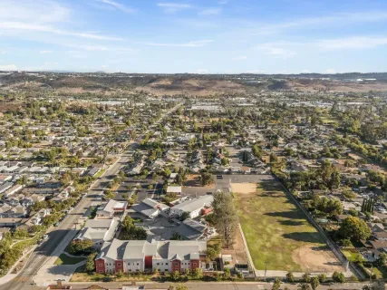 an aerial view of residential building and parking space