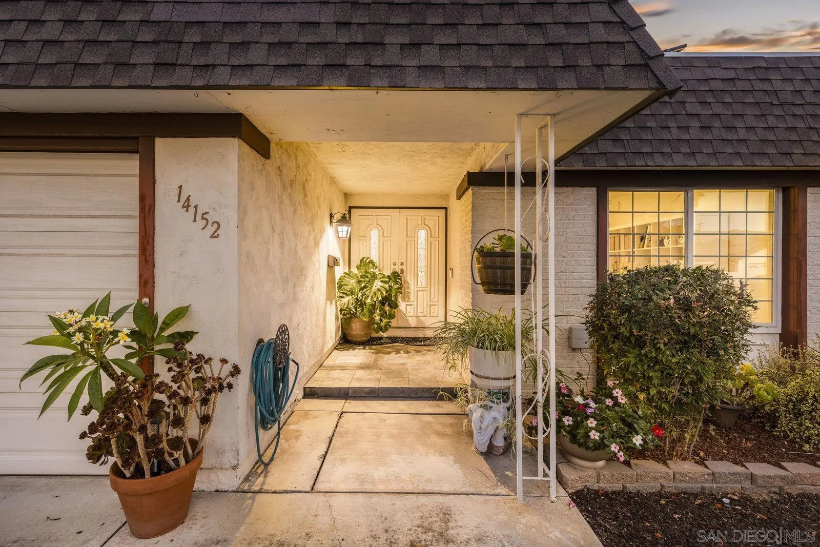 14152 Kendra Way Poway, CA 92064 - Photo 4 of 42 a view of a porch with potted plants