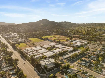 an aerial view of residential houses with outdoor space
