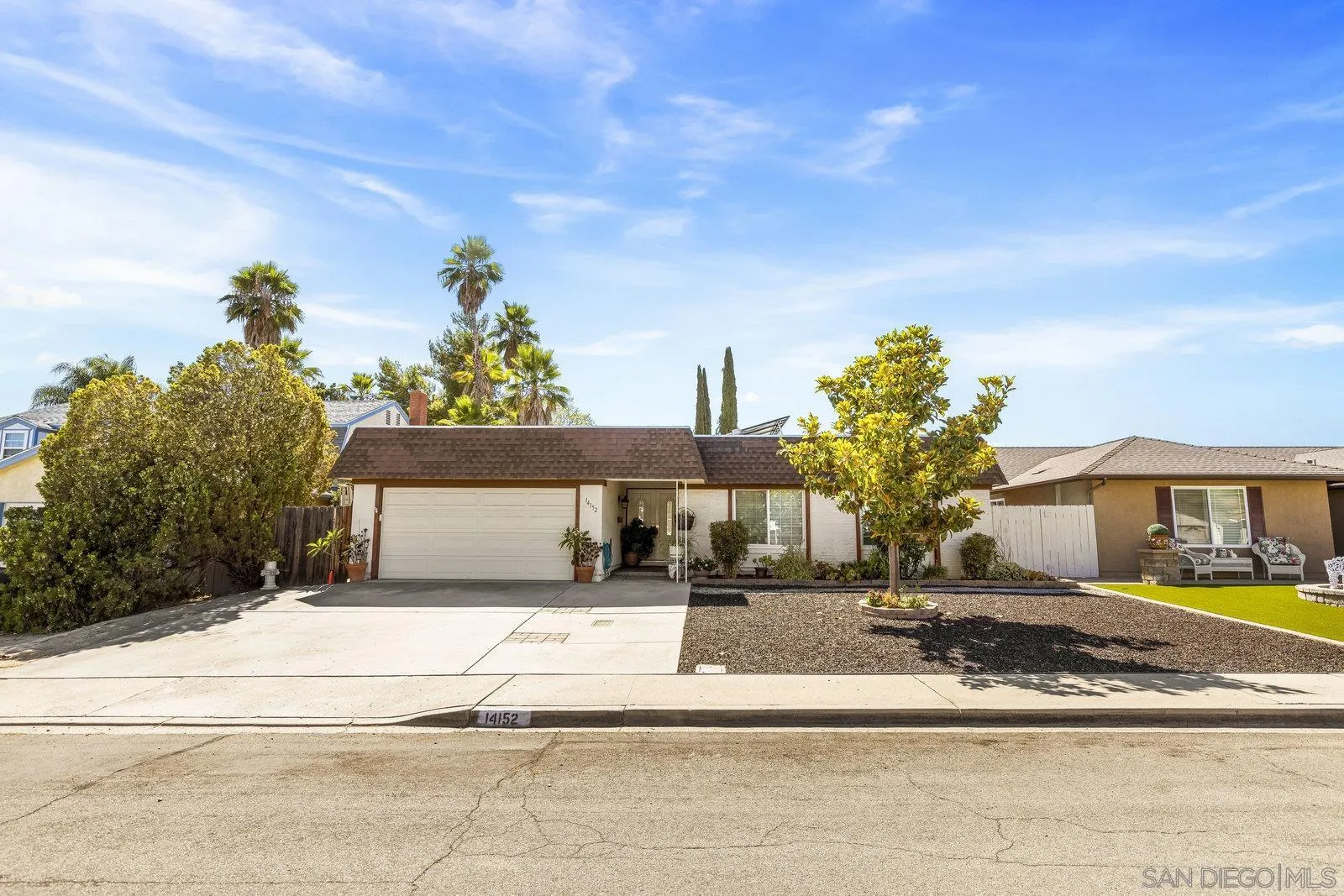 14152 Kendra Way Poway, CA 92064 - Photo 5 of 42 a front view of a house with a yard