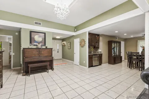 a kitchen with stainless steel appliances kitchen island granite countertop a refrigerator and a sink