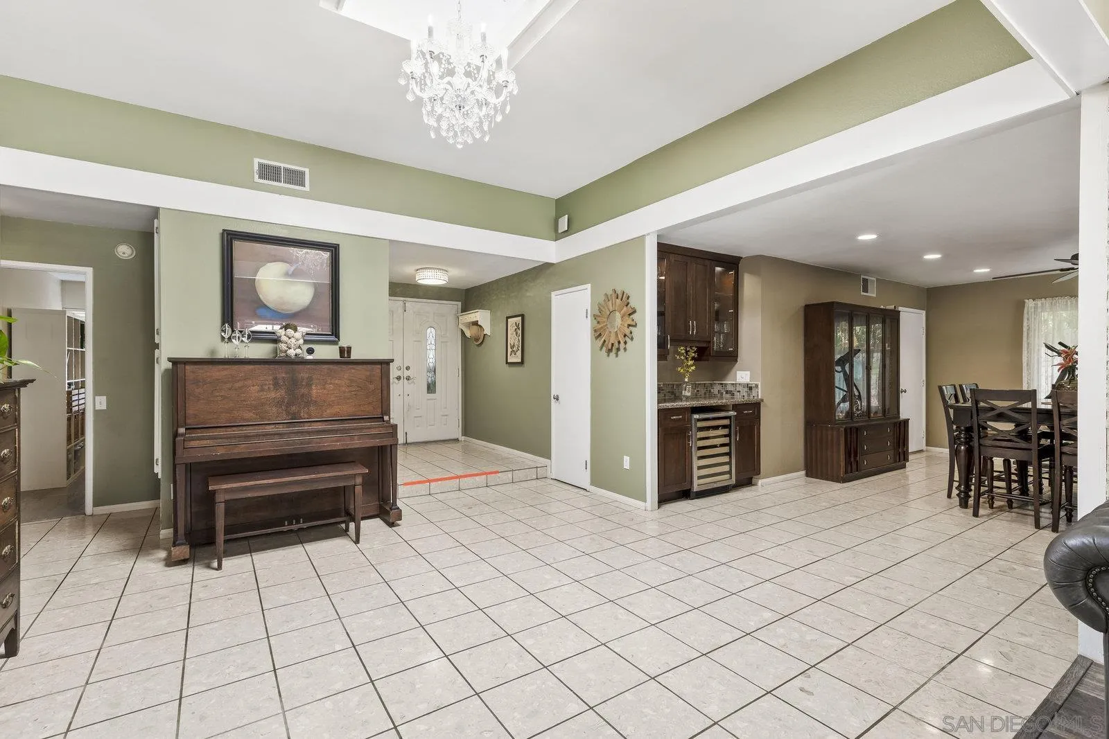 14152 Kendra Way Poway, CA 92064 - Photo 7 of 42 a kitchen with stainless steel appliances kitchen island granite countertop a refrigerator and a sink