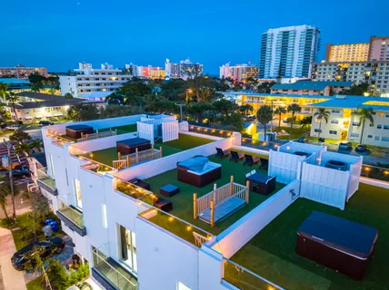 a view of a chairs and table in a terrace