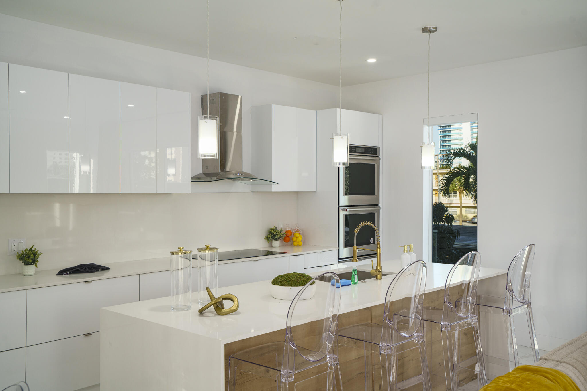 1000 North Riverside Drive Pompano Beach, FL 33062 - Photo 32 of 39 a kitchen with stainless steel appliances kitchen island granite countertop a sink and cabinets