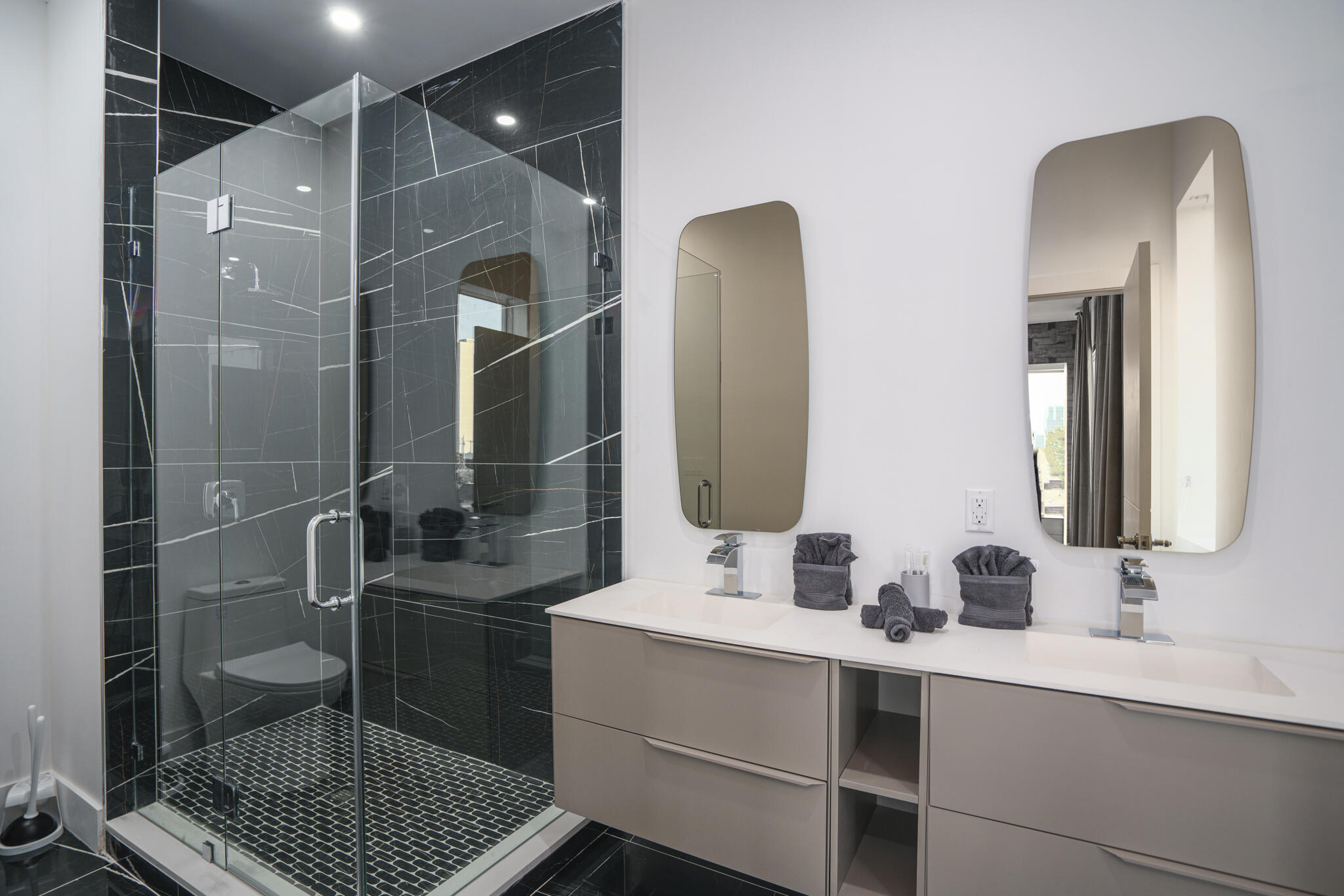 1000 North Riverside Drive Pompano Beach, FL 33062 - Photo 36 of 39 a bathroom with a double vanity sink a mirror and shower