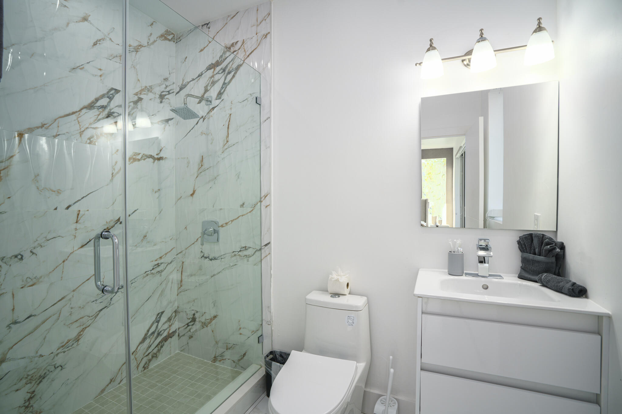 1000 North Riverside Drive Pompano Beach, FL 33062 - Photo 38 of 39 a bathroom with a sink a toilet and shower