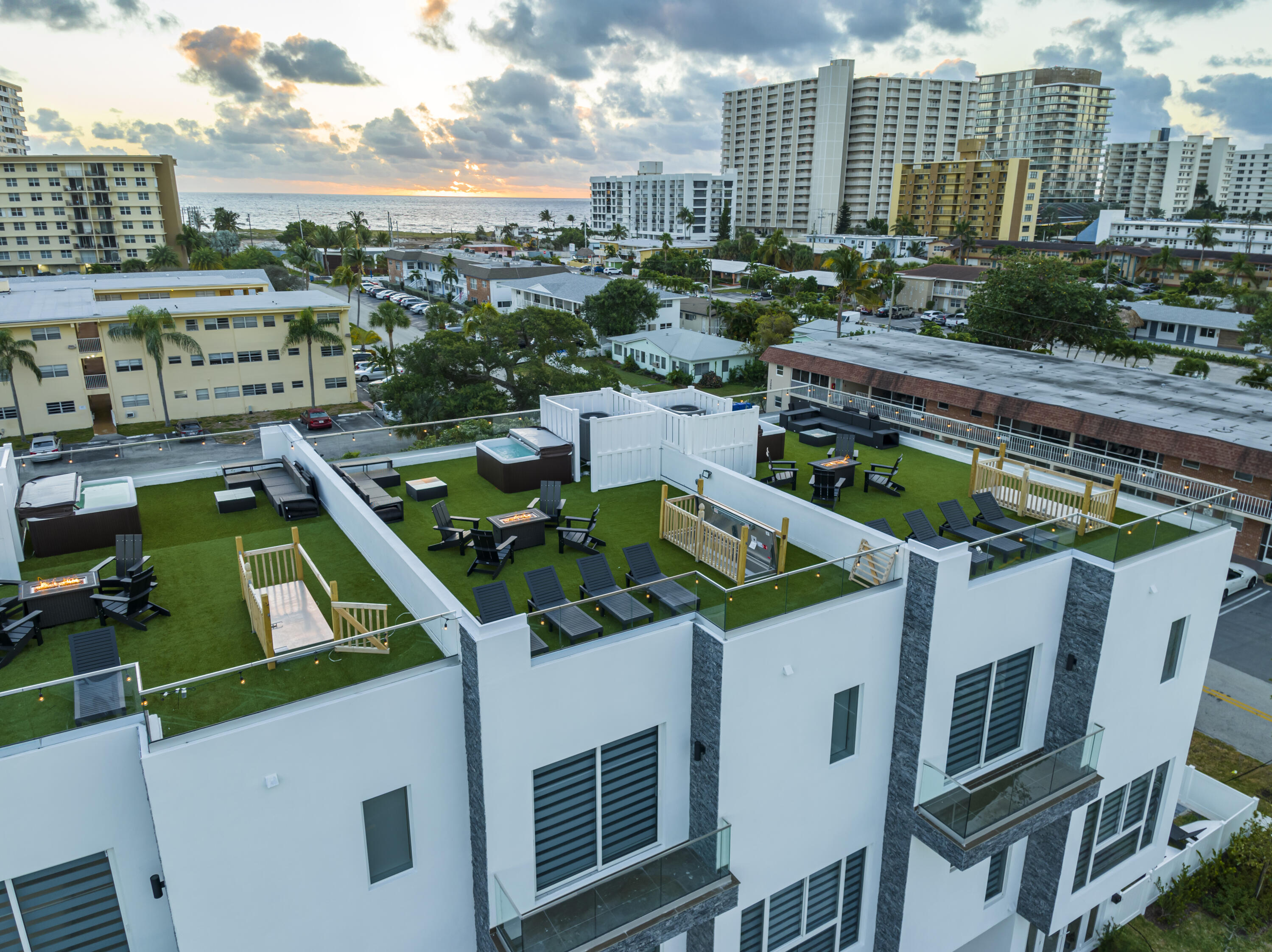 1000 North Riverside Drive Pompano Beach, FL 33062 - Photo 8 of 39 a view of a swimming pool with outdoor seating and plants